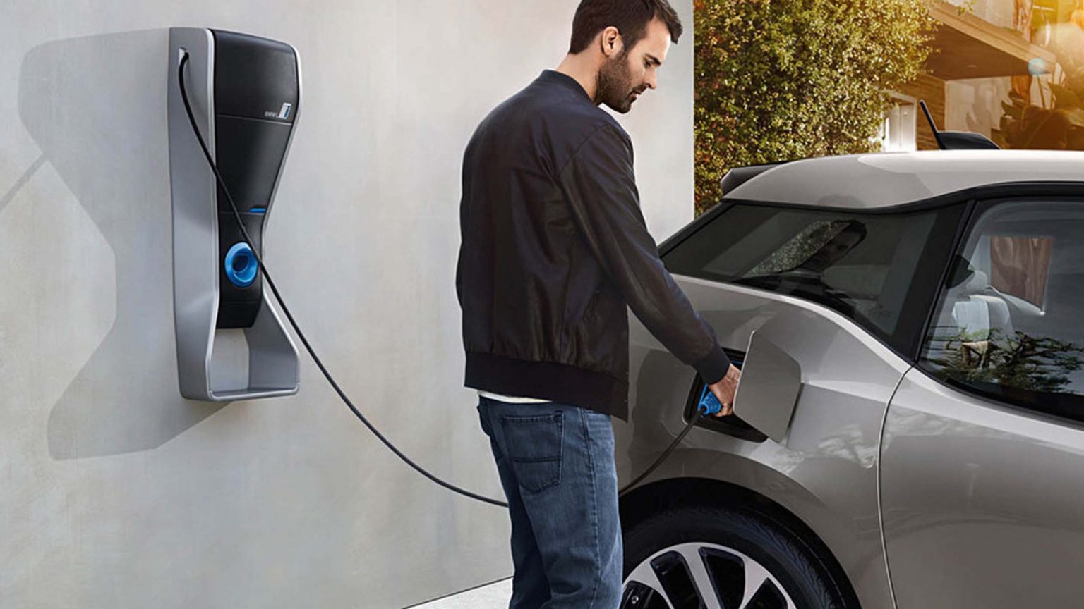 Person charging Electric Car