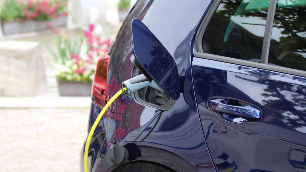 Blue EV being charged