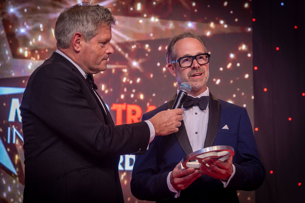 Richard accepting award