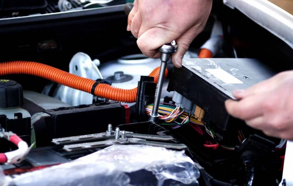 under hood servicing an electric car