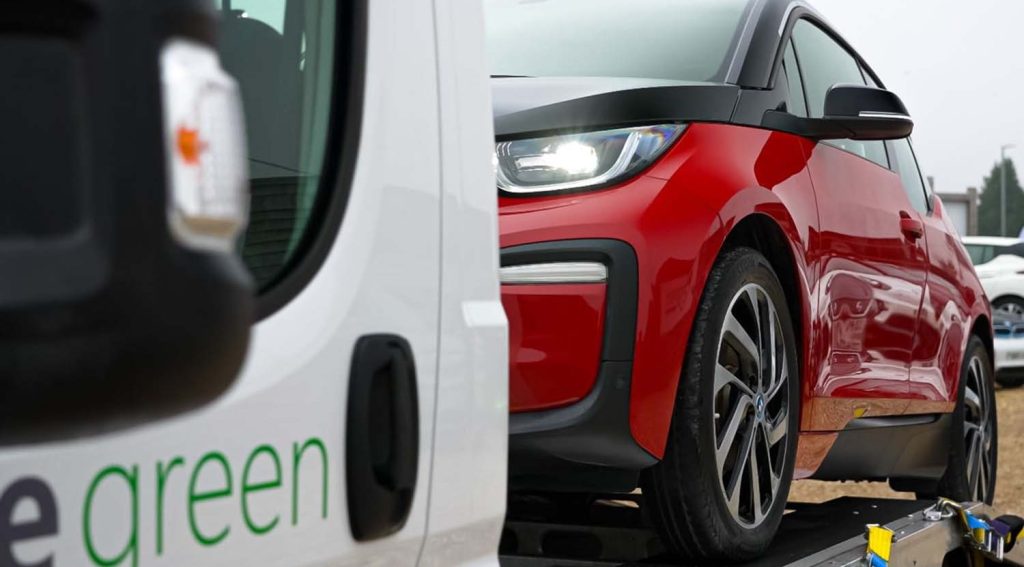 car on transporter for delivery