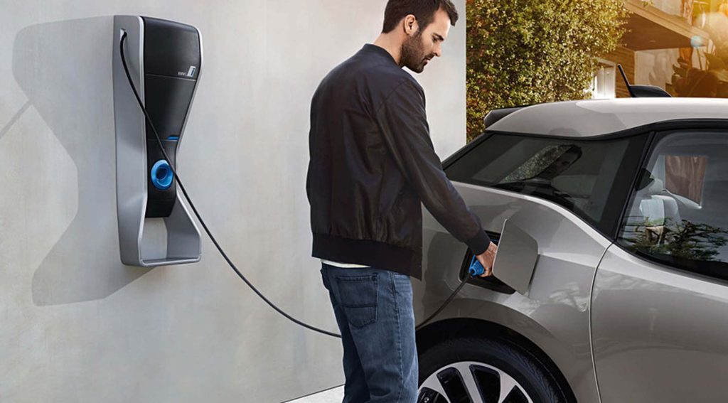 Person charging Electric Car