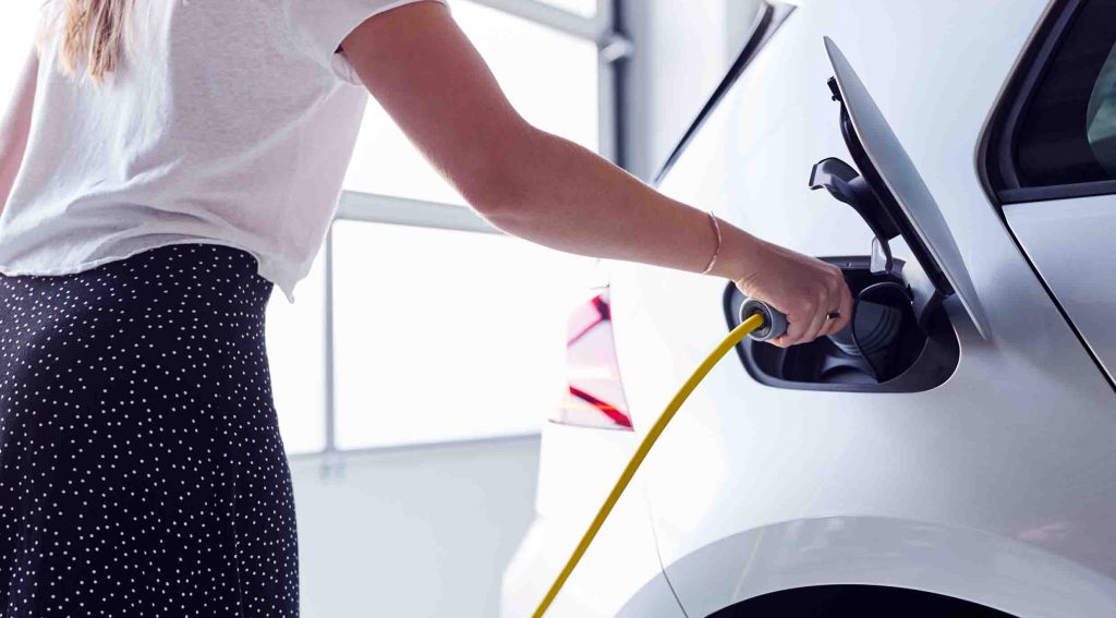 Person charging an EV